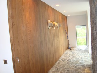 NATURAL WOOD PANELED PIVOT DOOR